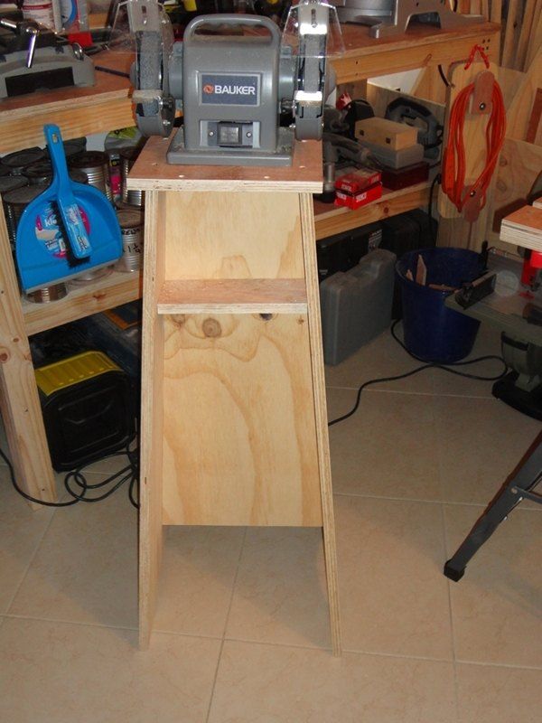 a workbench with tools on it in a workshop