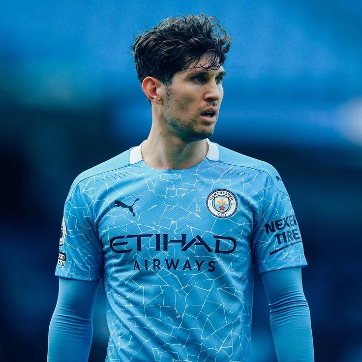 the manchester city player is looking on during a training session