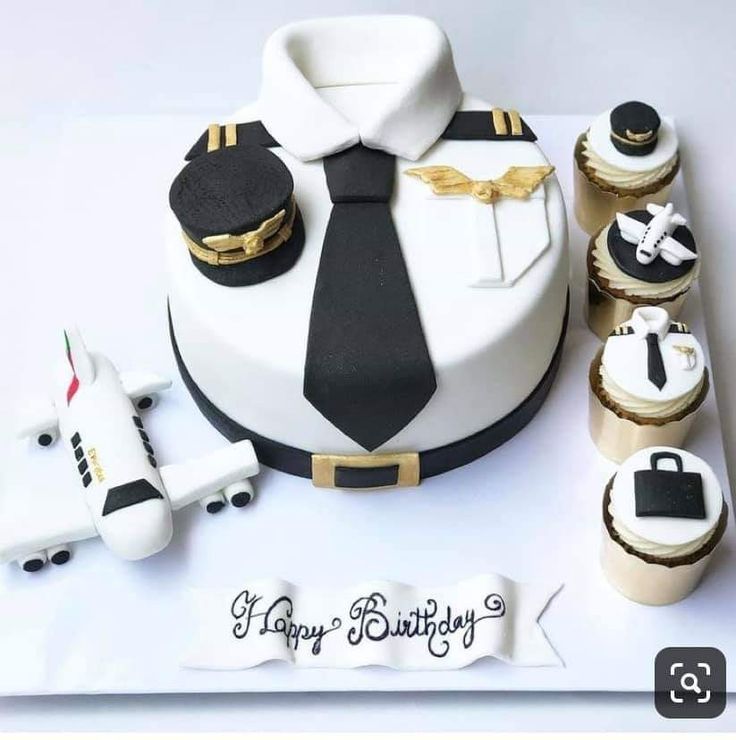 a birthday cake with cupcakes and an airplane