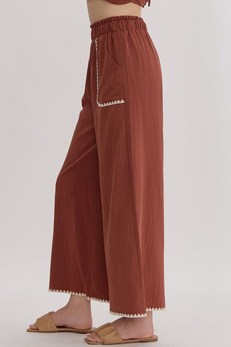 High waisted wide leg pants featuring trim detail. Elastic waistband, pocket at sides. Lined, woven, non-sheer, lightweight.49% rayon, 34% polyester, 17% nylon. True to size, I am an 8/10 wearing a medium. Small 4-6Medium 8-10Large 12-14 Casual Wide-leg Pants With Seam Detailing, Casual Summer Bottoms With Seam Detailing, Chic Bottoms With Seam Detailing For Summer, Summer Workwear Bottoms With Seam Detailing, Spring Wide Leg Pants With Seam Detailing, Wide Leg Bottoms With Seam Detailing For Spring, Spring Loungewear Bottoms With Contrast Trim, Spring Wide Leg Bottoms With Contrast Trim, Brown Wide Leg Pants With Side Pockets