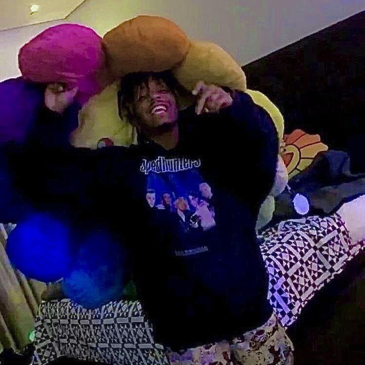 two people with stuffed animals on their heads and one person holding onto the other's head