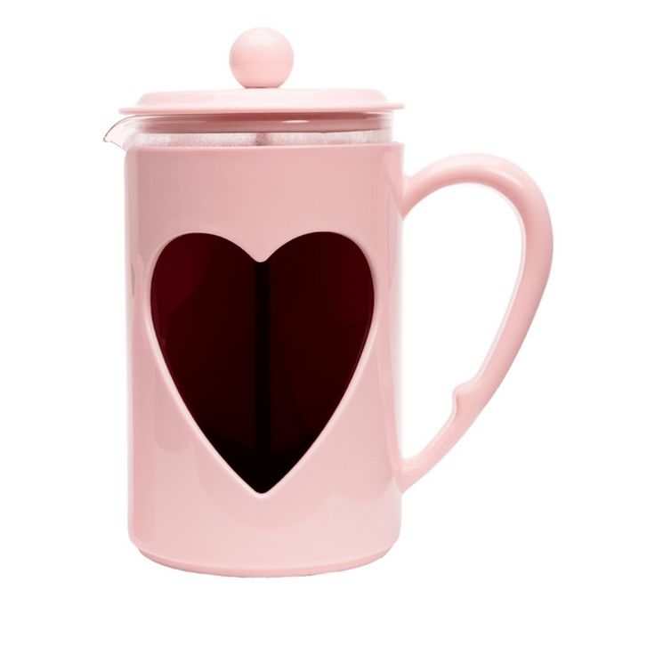 a pink coffee mug with a heart cut out