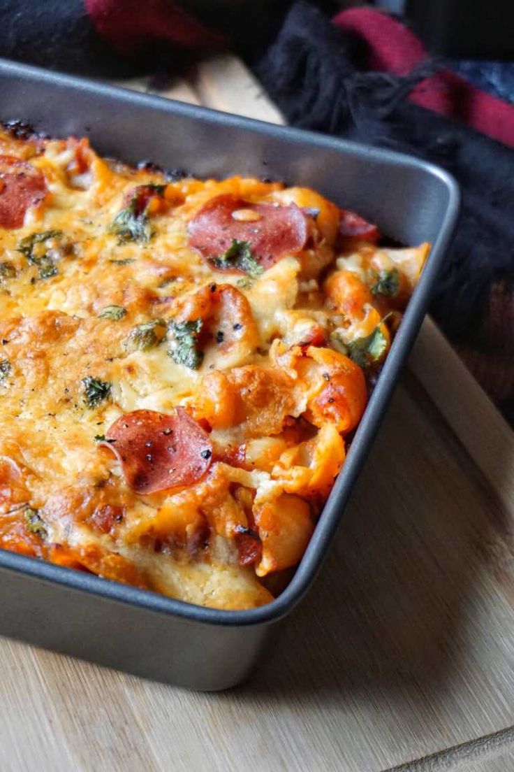 a casserole dish with ham, cheese and broccoli