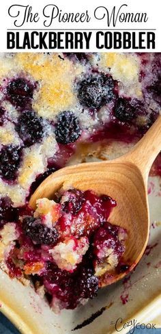 blueberry cobbler in a casserole dish with a wooden spoon