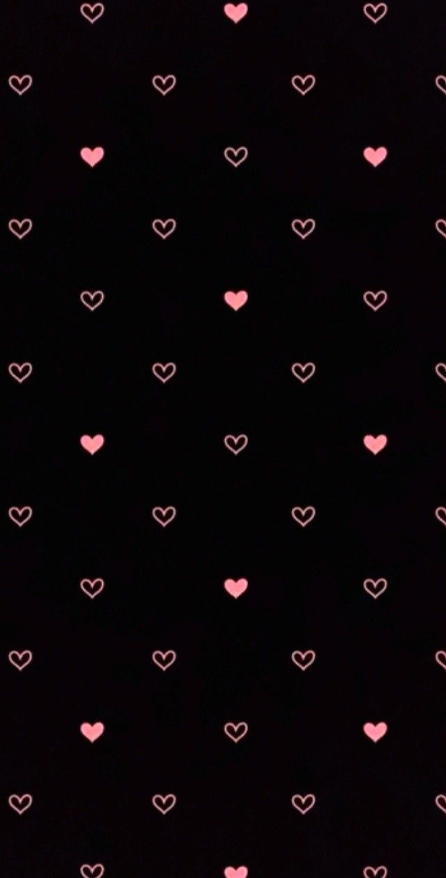 a black background with pink hearts on it