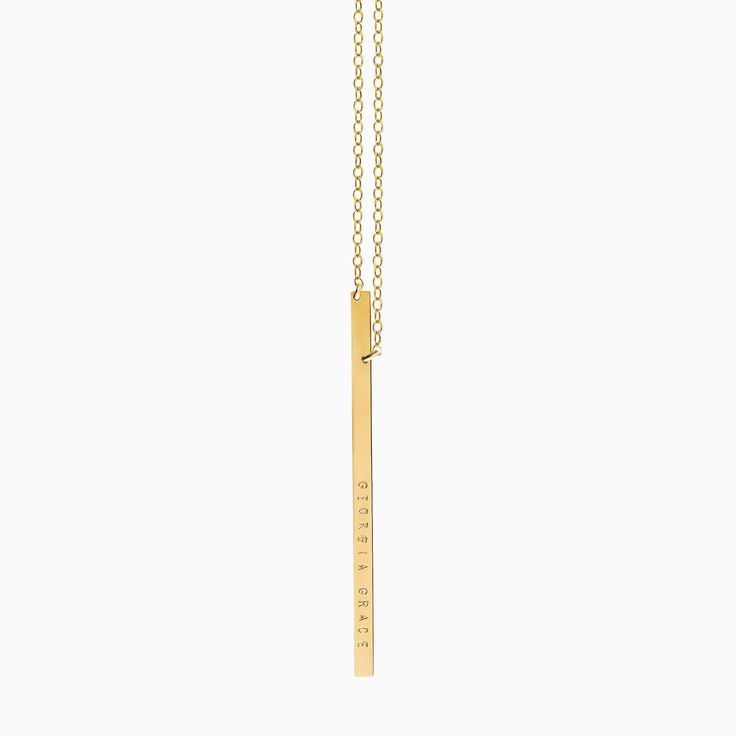 "Sleek, simple and made for everyday, our vertical bar necklace evokes effortless cool and is available in 14k gold filled or sterling silver. The long slim bar may be personalized with up to 18 characters in total, and is hung from asymmetrical points, for an off-kilter look. We create our name bars from a thick gauge metal which gives this piece a high quality look! (All designs & text copyright LUCA jewelry LLC). (Model is wearing a 24 \" long necklace, with the bar hanging a further 2.5\ Personalized Gold Bar Necklace Minimalist Style, Gold Minimalist Bar Necklace With Cable Chain, Minimalist Yellow Gold Bar Necklace With Cable Chain, Minimalist Bar Necklace With Cable Chain For Everyday, Minimalist Bar Necklace With Adjustable Chain For Everyday, Classic Gold Bar Necklace For Everyday, Everyday Minimalist Bar Necklace With Cable Chain, Minimalist Gold Bar Necklace For Everyday, Minimalist 14k Gold Filled Bar Necklace Gift