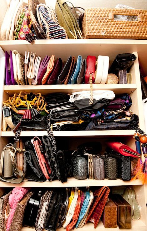 a closet filled with lots of different types of purses