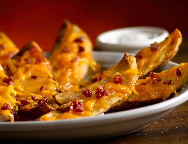 a white plate topped with cheesy bread sticks