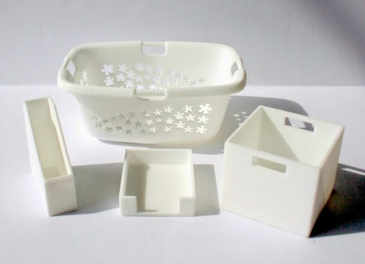 a set of three white ceramic dishes and boxes