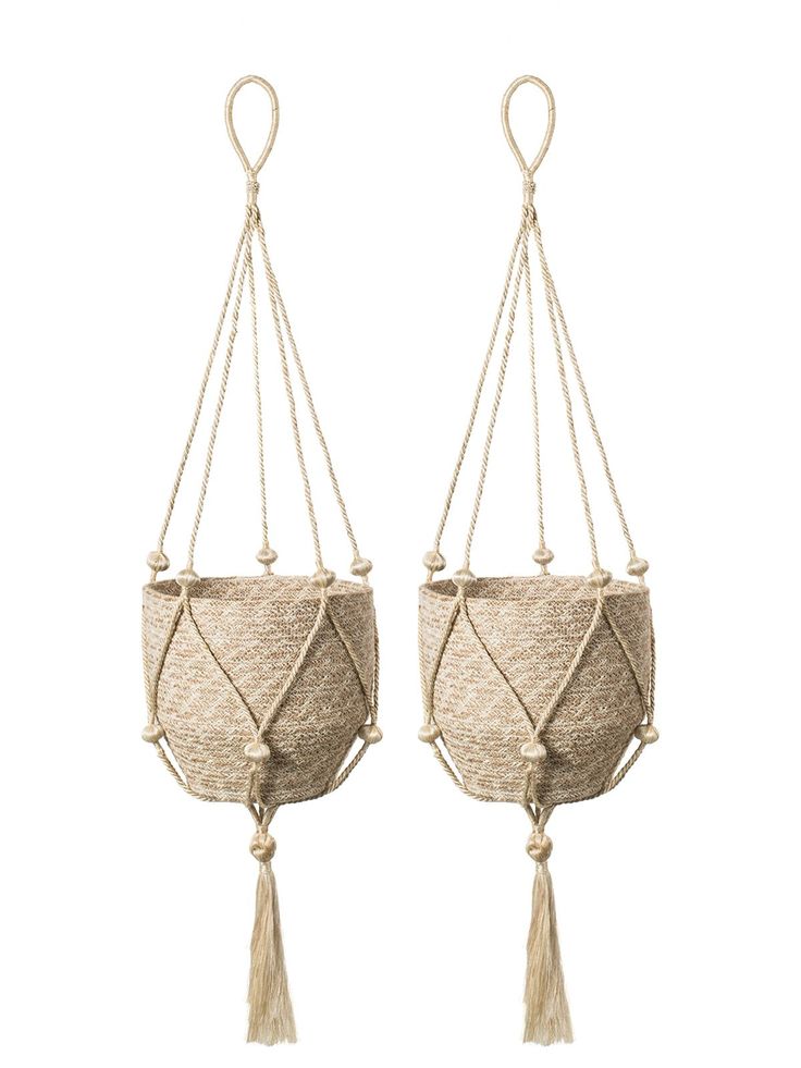 two macrame hanging planters with tassels and rope, one in beige