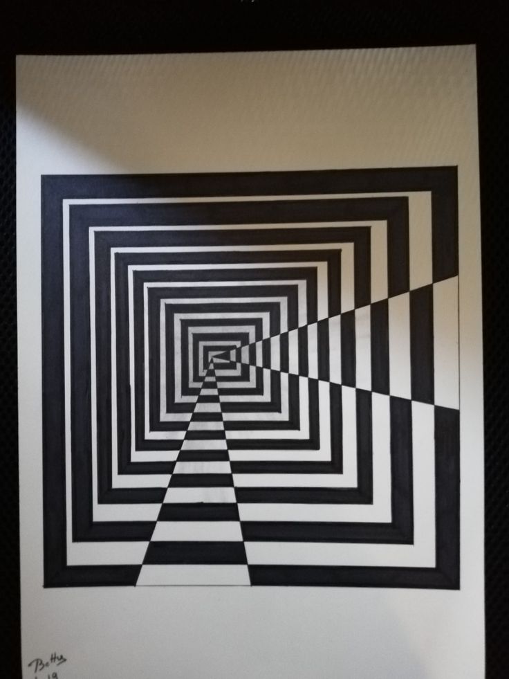 a black and white photo with an optical illusion pattern in the middle, on a wall