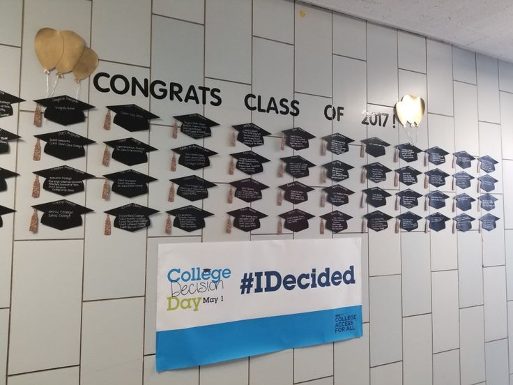 graduation caps and tassels are hanging on the wall