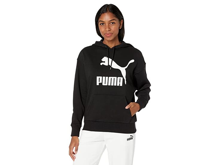 PUMA Classics Logo Hoodie - Women's Clothing : PUMA Black : Keep yourself warm without compromising on style with the PUMA Classics Logo Hoodie. Long sleeve fixed hood construction with a straight hemline. Drawstring adjustable hood. Kangaroo pocket. Printed metallic graphics at chest. 68% cotton, 32% polyester. Machine wash cold, line dry. Imported. Measurements: Length: 25 in Product measurements were taken using size SM. Please note that measurements may vary by size. Womens Puma, Graphic Logo, Kangaroo Pouch, Women Hoodies Sweatshirts, Womens Activewear, Keep Warm, Puma Jacket, Kangaroo Pocket, Adidas Jacket