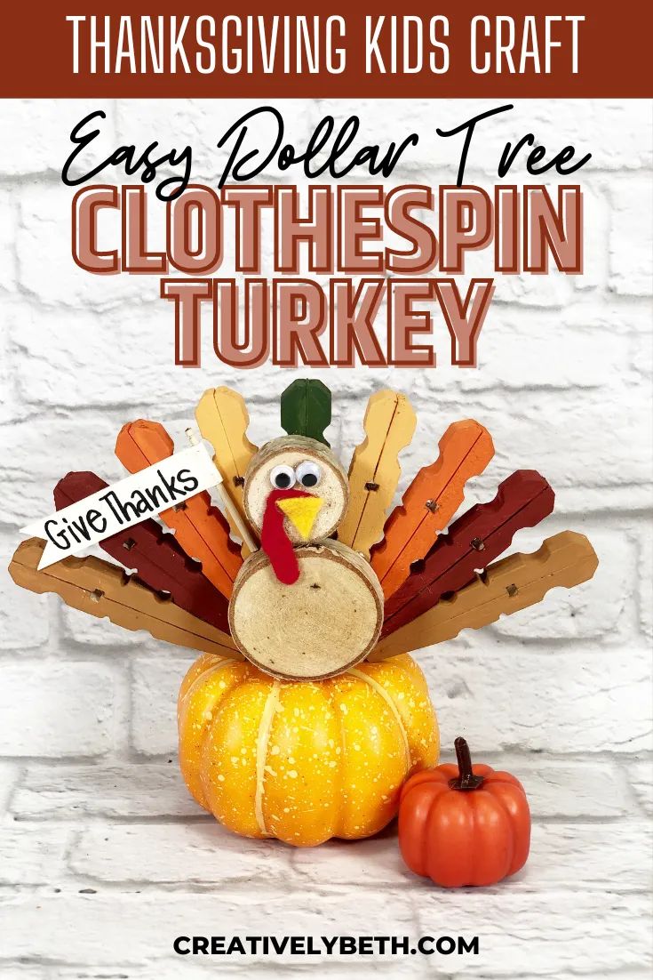 a paper turkey sitting on top of a pumpkin with the words easy dollar tree clothespin turkey