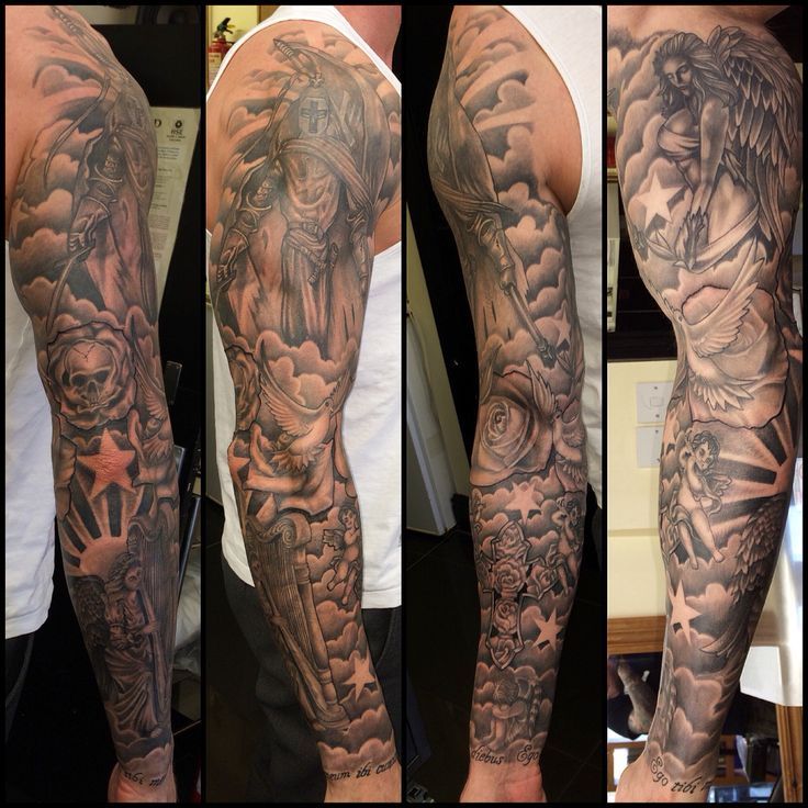 the arm is full of tattoos and has many different designs on it, including an angel