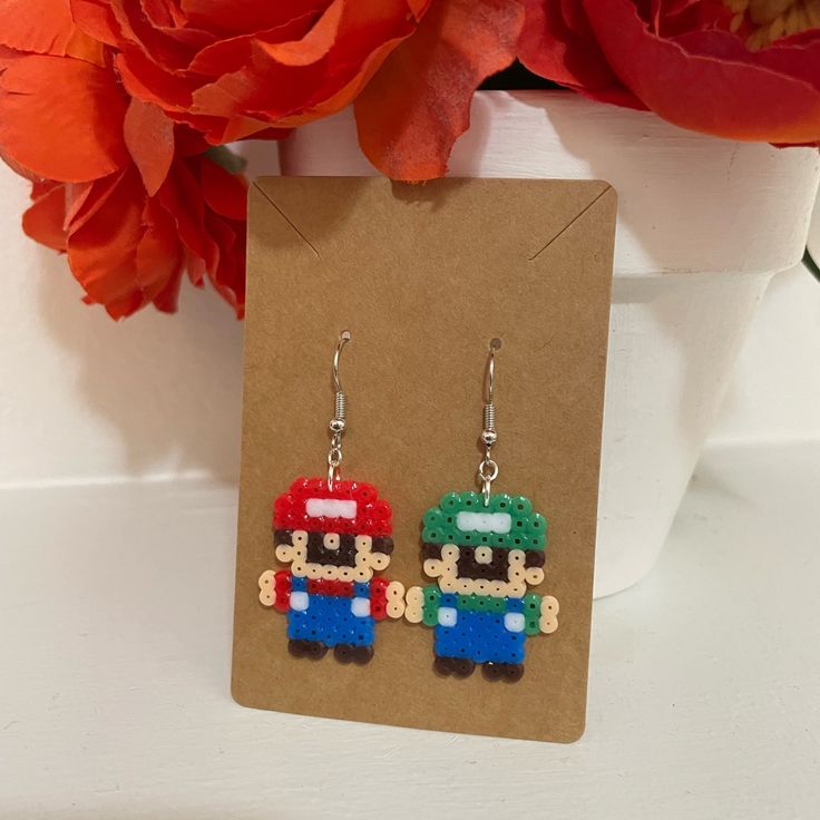 the earrings are made out of legos and have mario's face on them