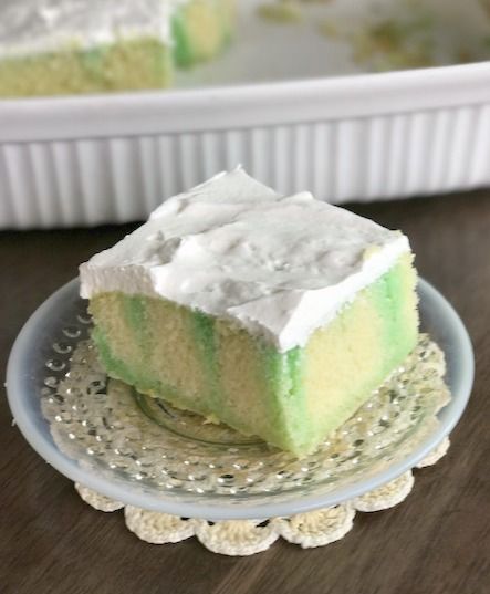 a piece of cake sitting on top of a glass plate next to a white tray