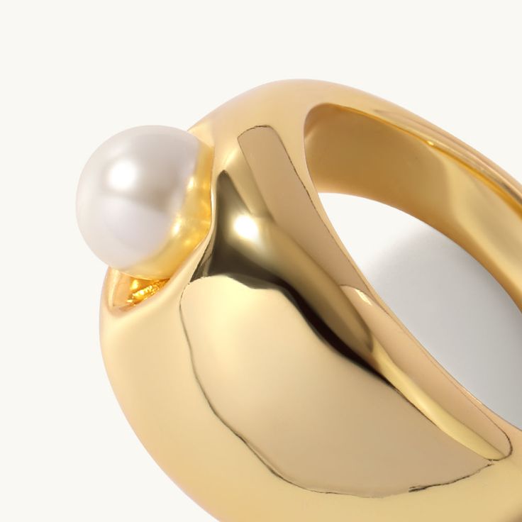 Elevate your stacking ring collection with this statement dented pearl ring, fusing a contemporary dented shape with the classic sophistication of pearls. A shimmering pearl sits in a geometric center, giving this unique ring a subversive-basic design.

Band Width: 16mm
Band Thickness: 2.8mm
Material: Pearl,18k Gold Plated On Brass Modern Pearl Ring For Formal Occasions, Modern Pearl Rings For Anniversary, Modern Pearl Open Ring For Anniversary, Modern Open Pearl Ring For Anniversary, Modern Gold Pearl Ring, Modern White Pearl Ring, Modern Pearl Wedding Ring, Modern Wedding Pearl Ring, Elegant Open Pearl Ring With Metal Band