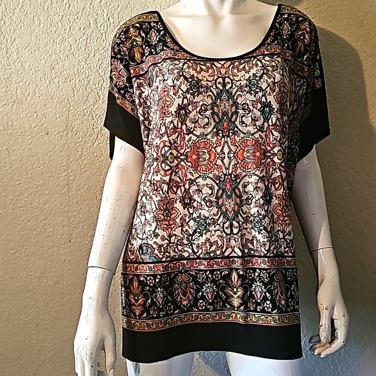 Paisley Short Sleeve Blouse, The Back Is All Black With A Button With An Opening. The Left Side Ties Up, Very Soft Material, Lightweight, Great Quality, New Never Worn. Black Short Sleeve Top With Paisley Print, Black Short Sleeve Tops With Paisley Print, Casual Black Blouse With Paisley Print, Black Bohemian Tops With Paisley Print, Casual Black Paisley Print Blouse, Paisley Print Patterned Short Sleeve Blouse, Patterned Paisley Print Short Sleeve Blouse, Black Tops With Paisley Print For Spring, Black Paisley Print Tops For Spring