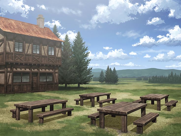 several picnic tables and benches in front of an old log cabin on a grassy field