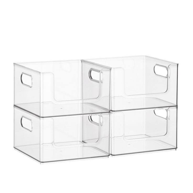 three clear plastic storage containers with handles on each side and one holding two empty bins