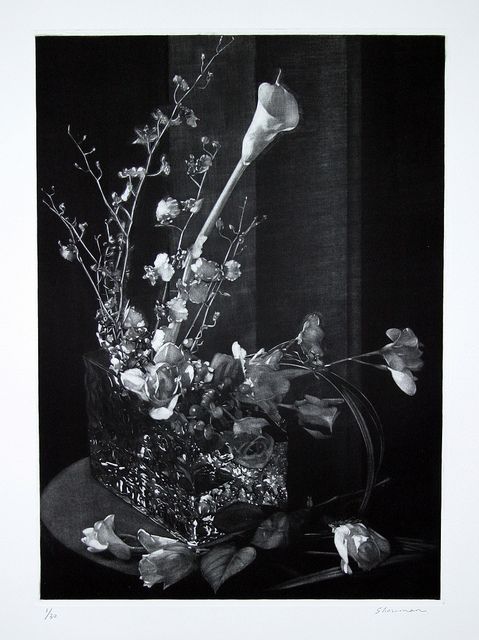 black and white photograph of flowers in a vase