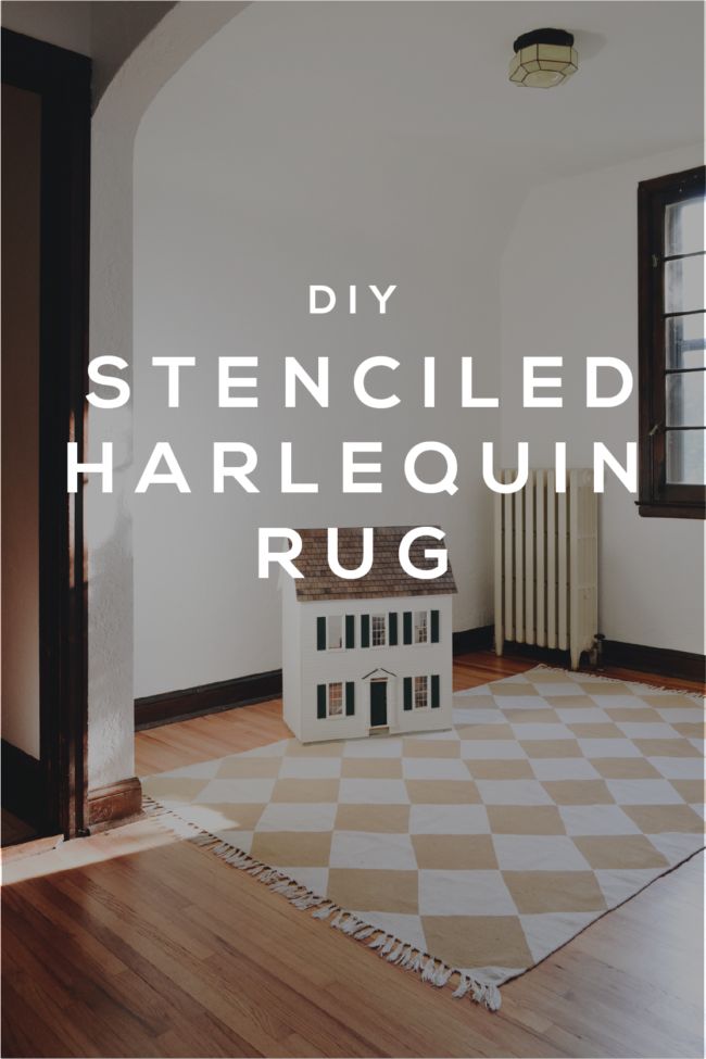 a living room with white walls and wood floors, the words diy stenciled harlequin rug