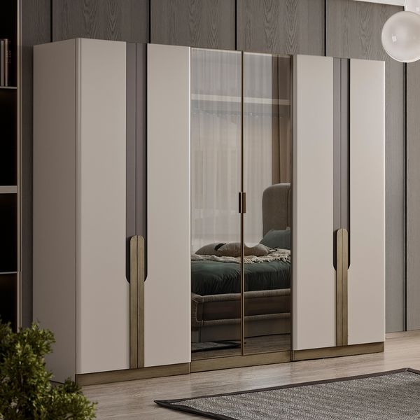 an image of a bedroom setting with mirrored closet doors and furniture in the room area