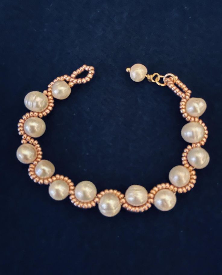 Handcrafted with rose gold bird seed and real 8 mm, fresh water, potato shape pearls. Lovely for wedding jewelry. Bracelet is about 6.5 inches long, and it can't be altered. Elegant Copper Bracelet As A Gift, Elegant Copper Bracelets As Gift, Elegant Copper Bead Jewelry, Elegant Copper Beaded Jewelry, Elegant Beaded Copper Jewelry, Rose Gold Pearl Beaded Bracelets, Rose Gold Pearl Beaded Bracelets With Round Beads, Handmade Rose Gold Round Beaded Bracelets, Rose Gold Beaded Pearl Bracelets