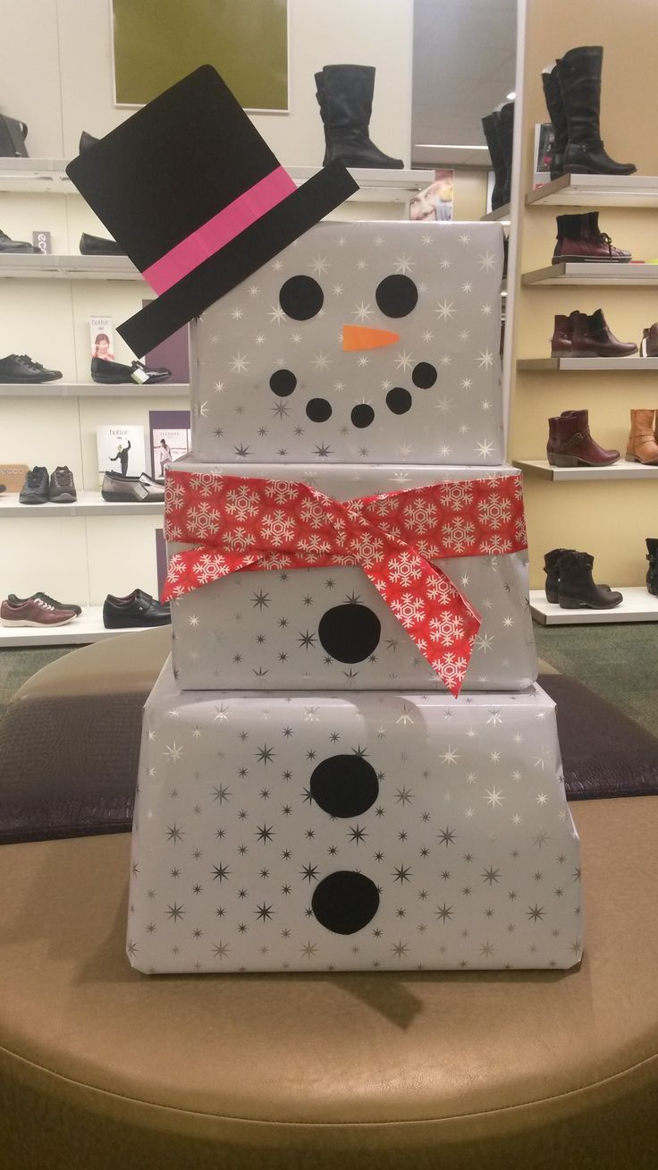 three snowmen are stacked on top of each other