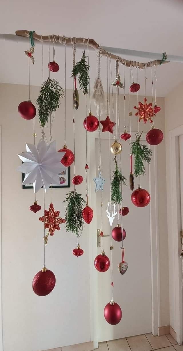 christmas decorations hanging from the ceiling in a room