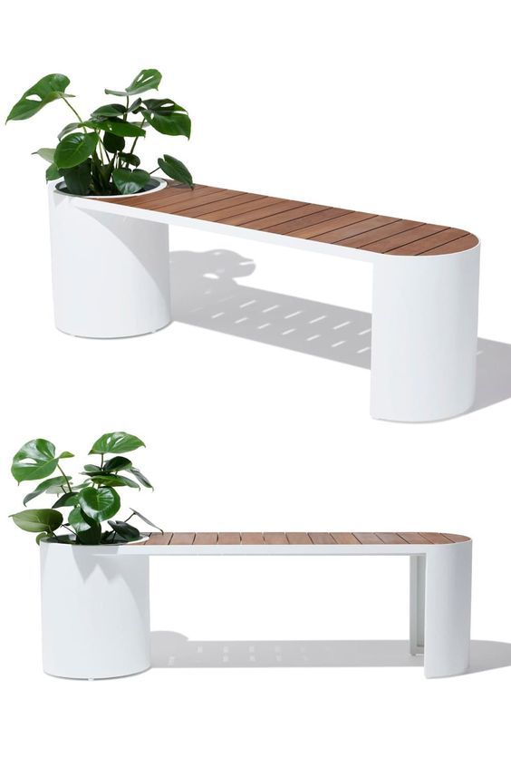 two white benches with plants in them and one bench has a planter on it