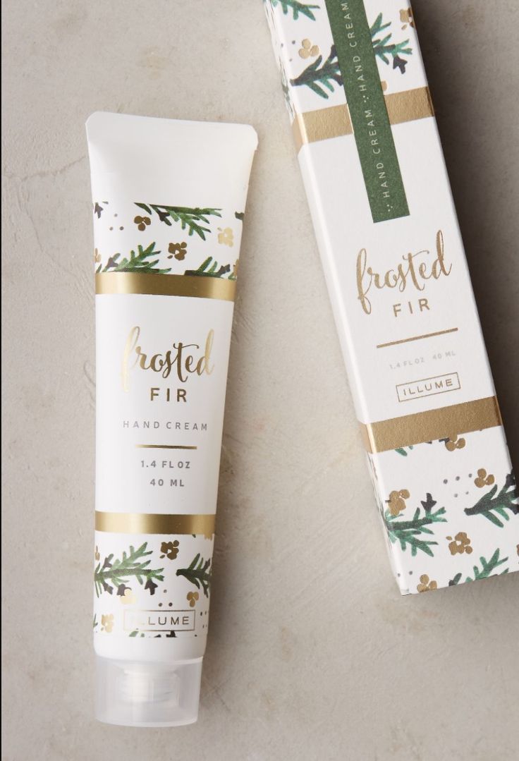 a tube of frosted fir hand cream next to a box on a table top