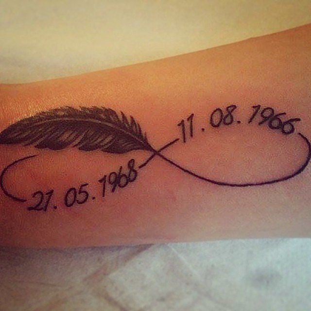 a tattoo with a feather and date on it