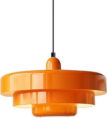 an orange pendant light hanging from a ceiling