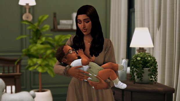 a woman holding a baby in her arms while standing next to a table with a potted plant