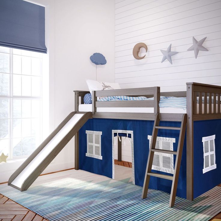 a child's bedroom with a bunk bed and slide