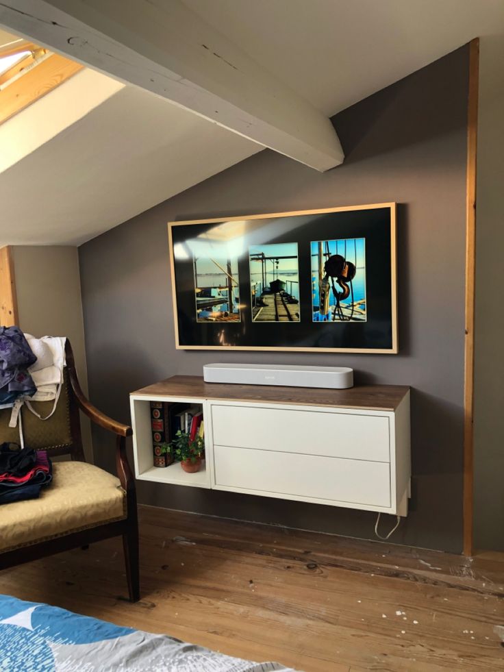 a flat screen tv mounted to the side of a wall