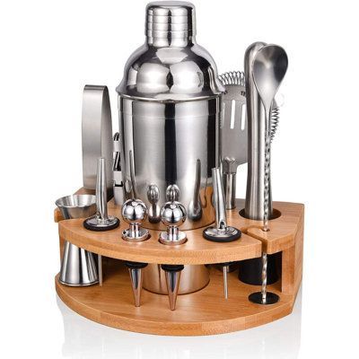 an assortment of kitchen utensils on a wooden stand