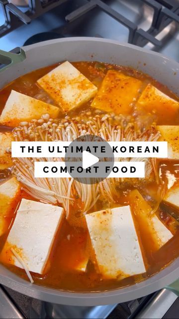 the ultimate korean comfort food in a pot on top of an open stove with text overlay