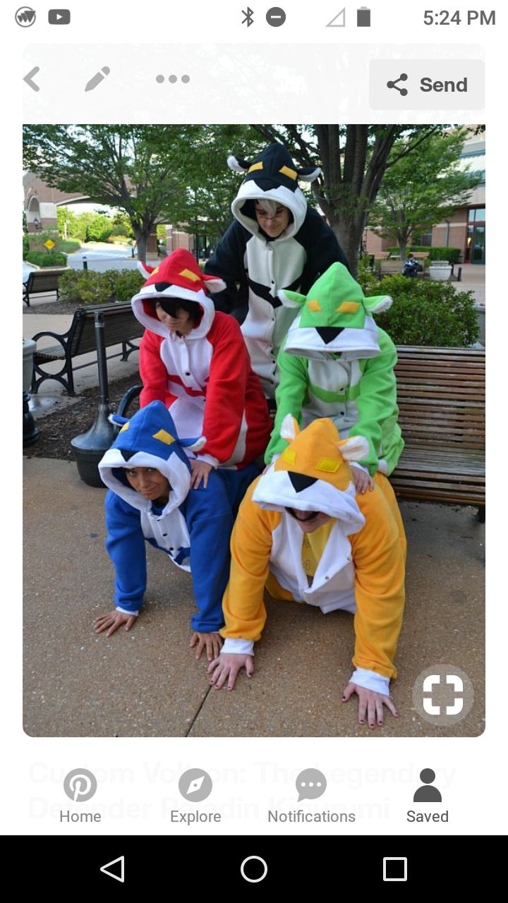 four people in costumes sitting on a bench