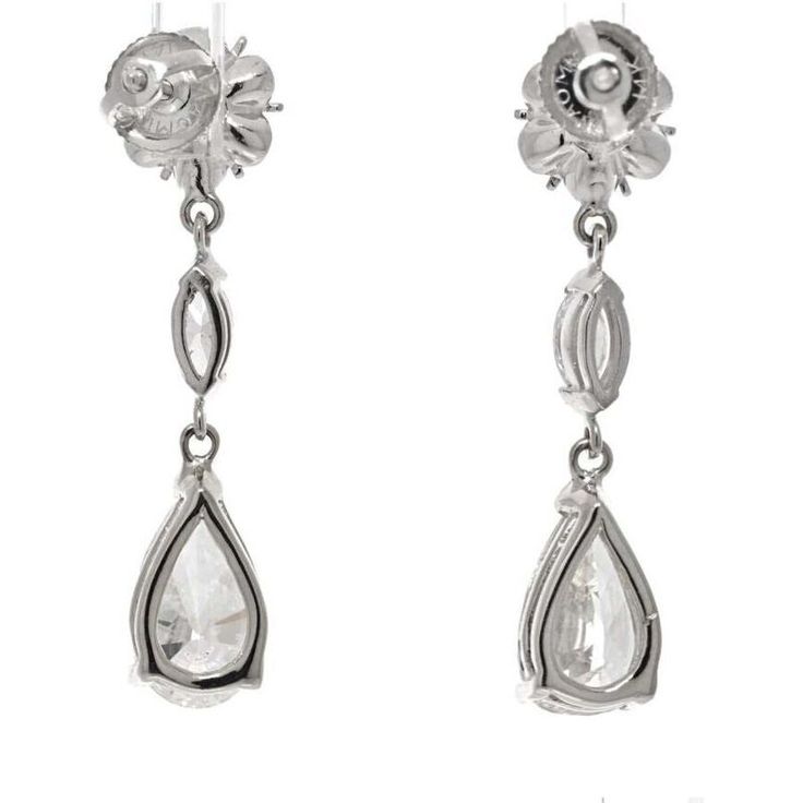 Discover the epitome of elegance with our stunning 14K White Gold 4.42 Carat Diamond Drop Pear Cut Earrings. These delicate earrings are a true testament to the beauty and brilliance of diamonds. Crafted with meticulous attention to detail, they feature a total diamond weight of 4.42 carats, ensuring a captivating sparkle that will mesmerize all who behold them.The pear cut diamonds take center stage, with two dazzling stones weighing 2.29 carats and 2.13 carats respectively. Their exquisite sha Elegant Pear-shaped Diamond Earrings For Evening, Timeless Pear-shaped Diamond White Earrings, Timeless Pear-shaped Diamond Earrings For Formal Occasions, Classic Teardrop Diamond Earrings For Evening, Formal White Gold Pear-shaped Earrings, Formal Pear-shaped White Gold Earrings, Timeless Diamond White Pear-shaped Earrings, Timeless Pear-shaped Diamond Earrings, Diamond White Pear-shaped Timeless Earrings