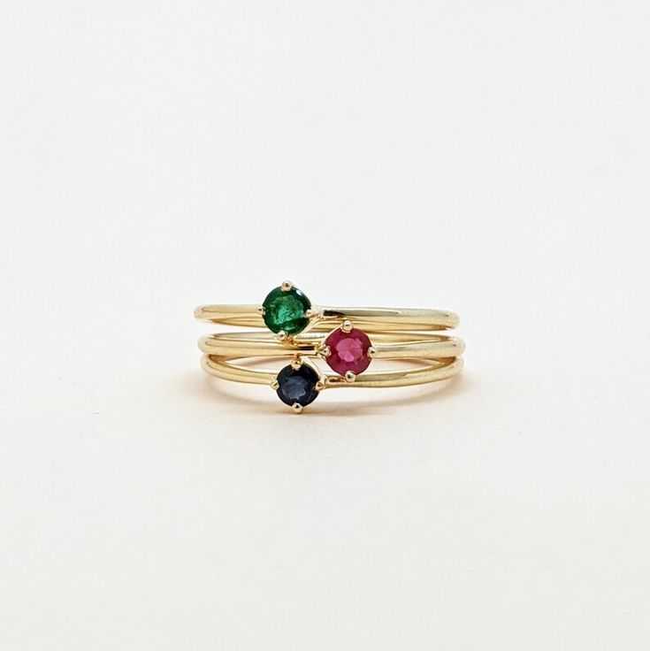 Natural Ruby, Emerald, Sapphire Round Cut Stackable Ring, Set of Gold Ring. Precious Gemstone Ring in 14k SOLID GOLD For Her from our Capsule Jewelry Collection. Ruby, Emerald, Sapphire Stone is set in Prong Setting in our Factory. Gold Ring AAA+ Quality. Perfect Gift For Everyday or Gift for Your Loved Ones. ► DIMENSIONS : ◆ Gemstone : Emerald, Ruby, Sapphire ◆ Stone size : 3*3 mm ◆ Gross Weight : 1.100 grams (1 Ring) ◆ Shank Width : 1 mm Elegant Stackable Birthstone Ring, Adjustable 14k Gold Rings With Round Stone, Fine Jewelry Multi-stone Birthstone Ring, Elegant Stackable Rings With Prong Setting For May Birthstone, Stackable Ruby Ring Fine Jewelry, Fine Jewelry Stackable Round Ruby Ring, Stackable Round Ruby Ring Fine Jewelry, Elegant May Birthstone Stackable Rings With Prong Setting, Dainty 14k Gold Cluster Ring With Gemstone