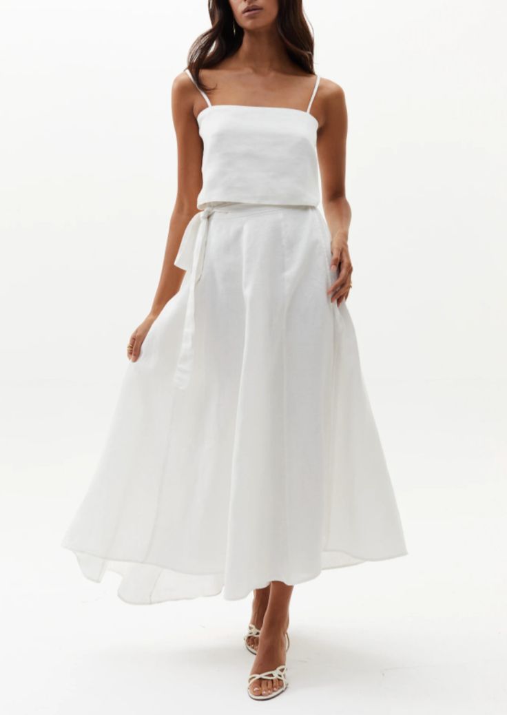 Our beloved Lola Wrap Skirt is perfectly flattering and elegant. This chic 100% linen skirt rests on the hip and flows down for a femenine silhouette. It features a tied closure with elastic waistband on the back for a perfectly adjustable fit, and on the back it has a central belt loop so that the tie stays in place. It is slightly longer on the back for a more dramatic and flirty effect. Size & Fit: Model is wearing size S/M Model’s measurements: Height: 5’ 10’’ / 179 cm Bust: 32.7’’ / 83 cm W Relaxed Linen Maxi Skirt For Vacation, Linen Flowy Skirt For Vacation, Flowy Linen Skirt For Vacation, Long Linen Skirt For Vacation, Linen Long Skirt For Vacation, Elegant Flowy Wrap Skirt For A Day Out, Vacation Long Linen Skirt, Fitted Linen Maxi Skirt For The Beach, Chic Flowy Wrap Skirt For Brunch