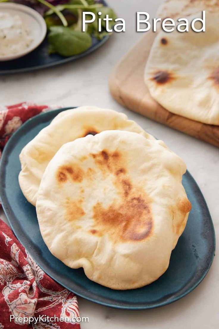 two pita breads sitting on top of a blue plate