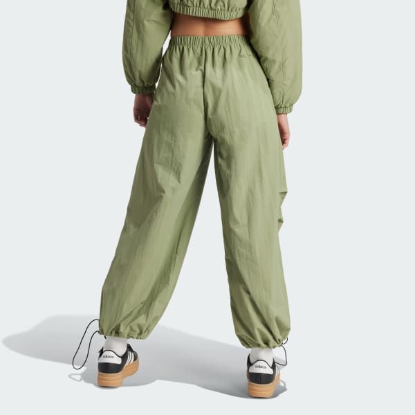 Sporty Adidas Joggers For Spring, Sporty Spring Cargo Pants With Drawstring, Sporty Spring Cargo Pants With Functional Drawstring, Athleisure Nylon Cargo Pants With Functional Drawstring, Nylon Athleisure Cargo Pants With Functional Drawstring, Adidas Bottoms With Pockets, Functional Adidas Bottoms With Pockets, Summer Utility Parachute Pants For Outdoor Activities, Sporty Parachute Pants For Summer Outdoor