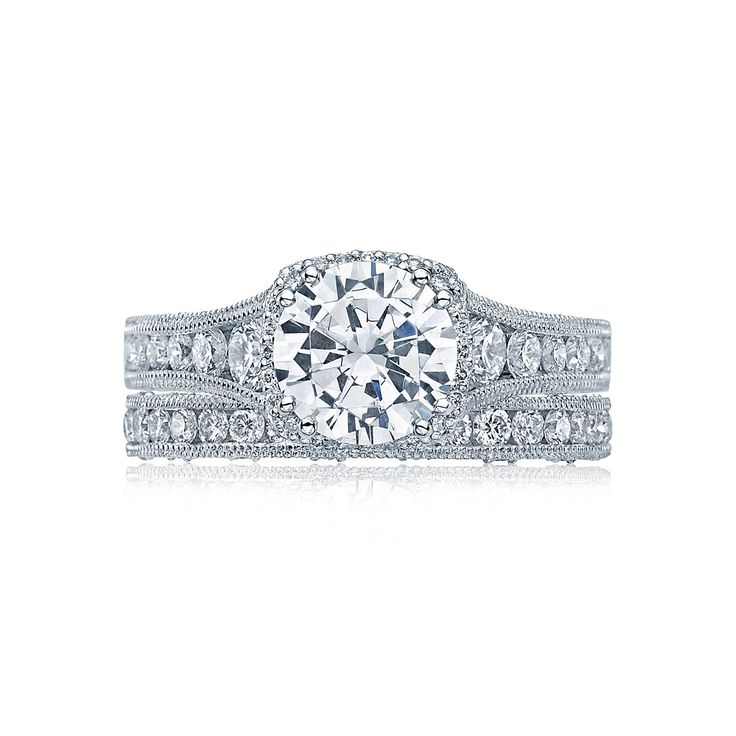 a white gold diamond ring set with two rows of diamonds on the band and side stones