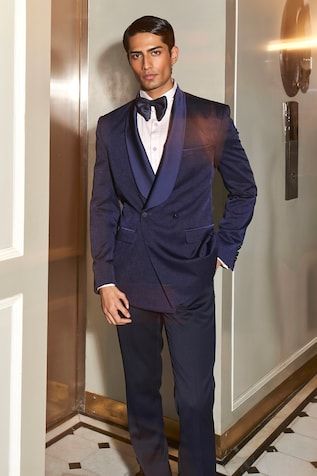 Navy blue full sleeves single breasted plain tuxedo with a satin shawl lapel. Paired with a trouser. - Aza Fashions Tailored Blue Single Breasted Tuxedo, Blue Single Breasted Tuxedo In Suiting Fabric, Blue Notch Lapel Tuxedo Three-piece Suit, Blue Single-breasted Tuxedo For Workwear, Silk Long Sleeve Single-breasted Tuxedo, Mens Trousers, Full Sleeve, Aza Fashion, Navy Blue