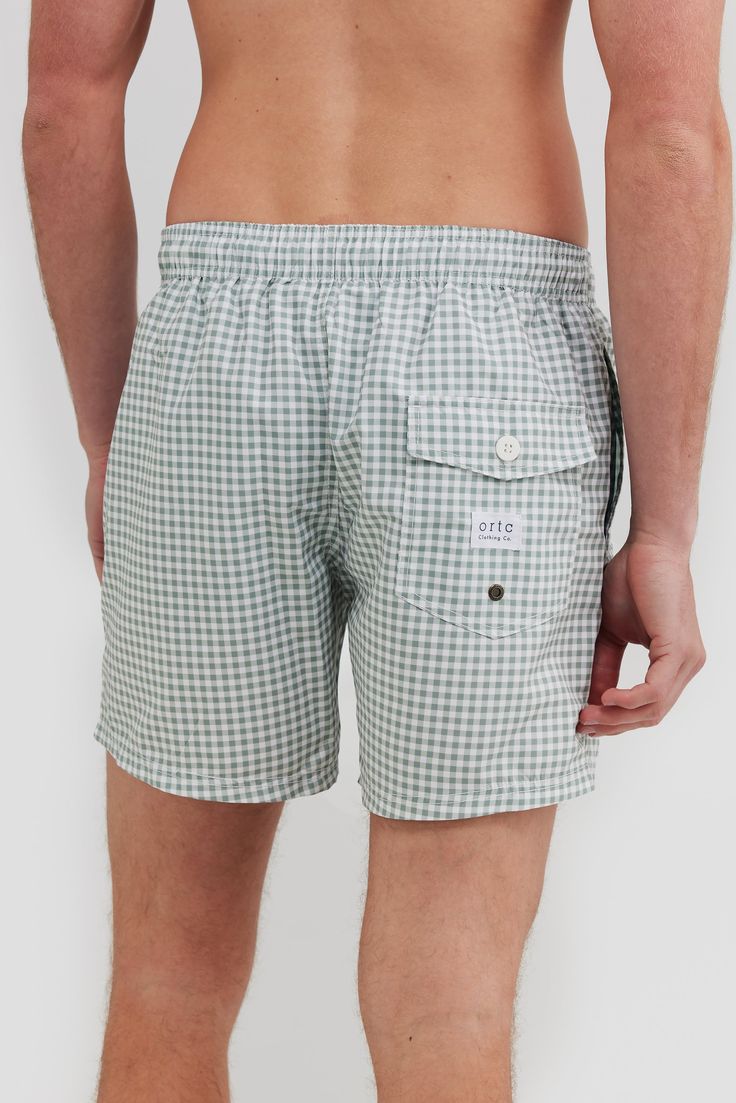 The Horrocks Sage Swim Shorts are the perfect addition to your summer wardrobe. Made from 100% Recycled Polyester, these mid-length shorts are quick-drying and lightweight. An elastic waistband with a drawstring provides an adjustable fit, while internal fine mesh briefs provide extra comfort. Pair with one of our T-shirts to make the perfect summer look. Quick drying, mid-length swim shorts 100% Recycled Polyester Internal fine mesh briefs Elastic waistband with drawstring Two side pockets with rear button up pocket Designed in Australia. Made in China Casual Blue Swim Shorts With Relaxed Fit, Beach Swim Trunks With Pockets, Summer Bottoms With Drawstring And Short Inseam, Summer Nylon Bottoms For Vacation, Summer Drawstring Bottoms With Short Inseam, Beachwear Bottoms With Pockets For Warm Weather, Casual Poolside Shorts With Short Leg, Casual Shorts For Poolside, Summer Drawstring Bottoms