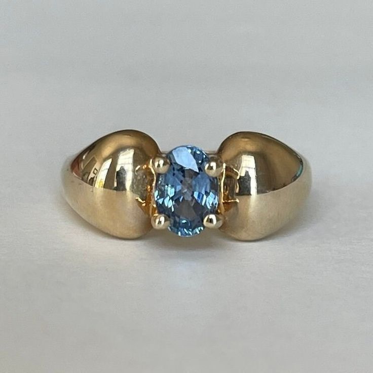 14K Gold CID Blue Topaz Stone Ring, Size 8, 4.6 grams, Clyde Duneier, Inc Size: 8 Weight: 4.6 grams Stones:  Blue Topaz Size Stone: ca. xxmm  Color Gemstone: Blue  Number of Gemstones: 1 Cut: Oval Markings: 14K, CID Maker: Clyde Duneier, Inc Bandwidth: ca. xxmm at smallest point  Tested: Tested with Mizar electronic gold tester ET18 (testing performed by 3rd person) Condition: Very good preowned with light usage throughout -refer to pictures for condition. All jewelry will be professionally clea Modern Yellow Gold Blue Topaz Ring, Blue Domed Gemstone Ring, Modern 14k Gold Topaz Birthstone Ring, Oval Topaz Birthstone Ring In Yellow Gold, Classic Blue Domed Jewelry, Classic Gold Blue Topaz Birthstone Ring, Gold Oval Blue Topaz Birthstone Ring, Classic Oval Topaz Birthstone Ring, Classic Oval Topaz Ring